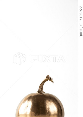 Golden decorative Halloween pumpkin top on white background.  81939271