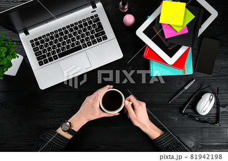Overhead view of businesswoman working at computer in office 81942198