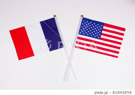 Flag of France and flag of USA crossed with each other on a white background. Isolated. The image illustrates the relationship between countries. Photo for news and articles on the media Flag of France and flag of USA crossed with each other on a white background. Isolated. The image illustrates the relationship between countries. Photo for news and articles on the media 81943059