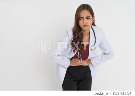 female doctor wearing white suit uniform holding stomach with both hands with pain expression 81943514