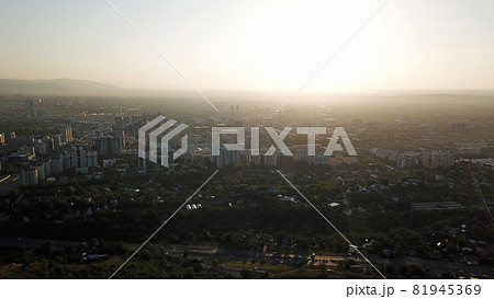 Bright yellow sun over the city of Almaty. Bright yellow sun over the city of Almaty. 81945369