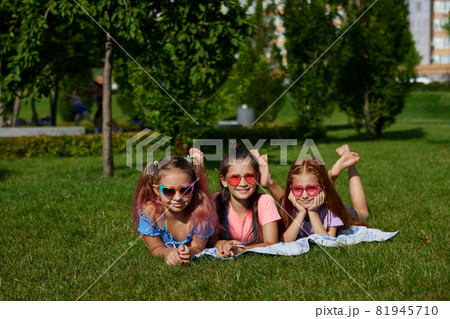 cute children girls playing together in the park 81945710