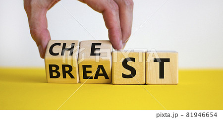 Chest or breast symbol. Businessman turns wooden cubes and changes the word 'breast' to 'chest'. Beautiful yellow table, white background. Social and chest or breast concept. Copy space. Chest or breast symbol. Businessman turns wooden cubes and changes the word 'breast' to 'chest'. Beautiful yellow table, white background. Social and chest or breast concept. Copy space. 81946654