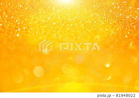 The blurred texture of the golden shine. Background with gold glitter or yellow sequins. Seamless texture with yellow gold sequins. Flickering background. High quality photo 81948022