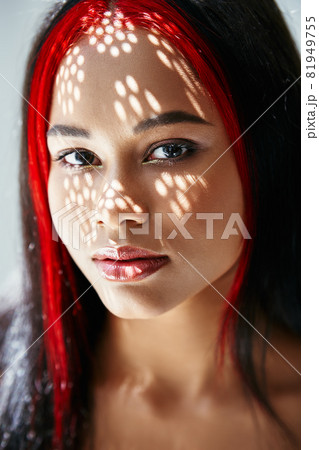 Portrait of pretty african american woman with shadows on her face Portrait of pretty african american woman with shadows on her face 81949755