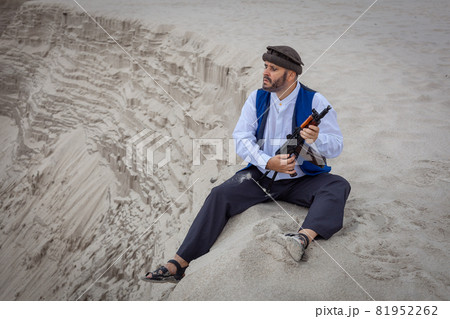 A Taliban soldier monitors a road in Afghanistan. A Taliban soldier monitors a road in Afghanistan. 81952262