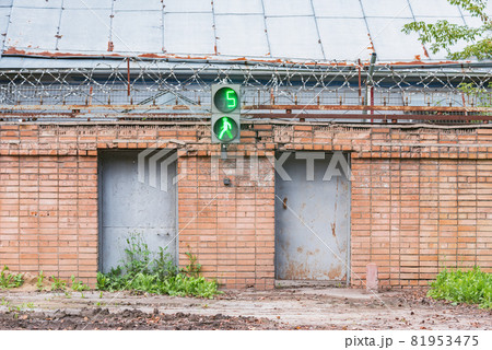 Brick fence with barbed wire. Brick fence with barbed wire. 81953475