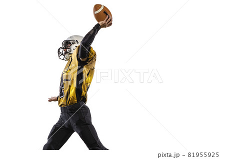 One professional american football player in special uniform isolated over white grass flooring background. Cropped image One professional american football player in special uniform isolated over white grass flooring background. Cropped image 81955925