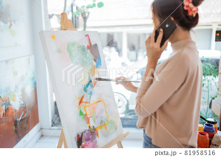 painter artist painting on canvas shoot from her back painter artist painting on canvas shoot from her back 81958516