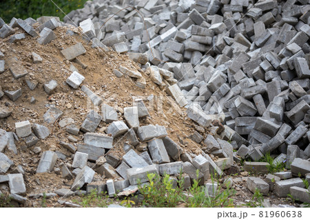 Pile of disassembled gray pavement bricks with selective focus Pile of disassembled gray pavement bricks with selective focus 81960638