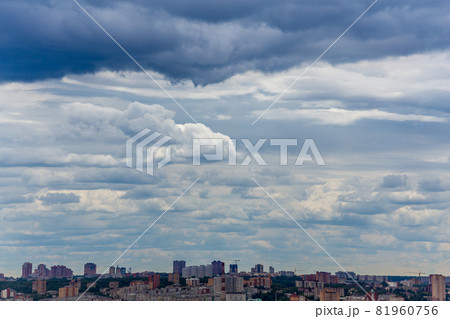 russian summer daylight cityscape with large cumulus clouds and tiny horizon line of the panel condominium houses russian summer daylight cityscape with large cumulus clouds and tiny horizon line of the panel condominium houses 81960756