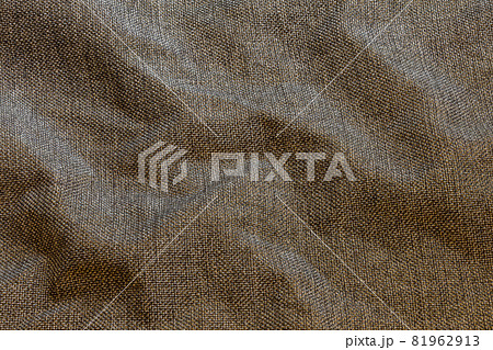 Brown crumpled dense rough fabric closeup background Brown crumpled dense rough fabric closeup background 81962913