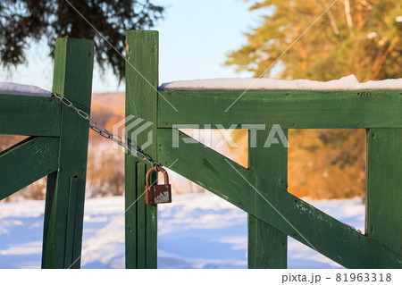 closed wooden gate at winter daylight 81963318