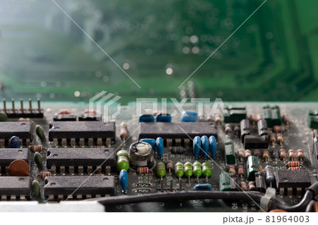 dark background of old electronic circuit board closeup with dus 81964003