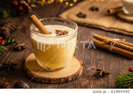 Eggnog with spicy cinnamon for Christmas and winter holidays,Cozy cocktail with milk and cinnamon and clove stars,Traditional Christmas drink with grated nutmeg and cinnamon,Homemade White Holiday Eggnog with spicy cinnamon for Christmas and winter holidays,Cozy cocktail with milk and cinnamon and clove stars,Traditional Christmas drink with grated nutmeg and cinnamon,Homemade White Holiday 81964490