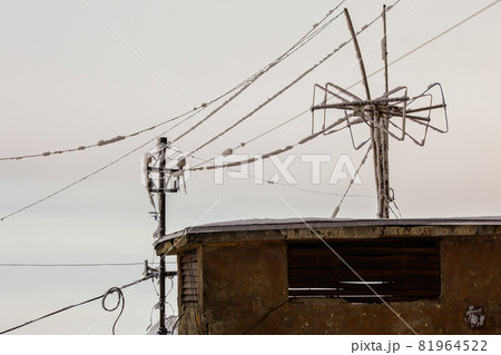Frozen 5 GHz wireless repeater antennas pillar at winter night 81964522