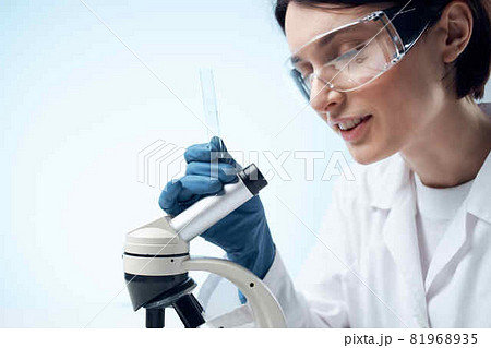 woman wearing medical mask laboratory microscope science research woman wearing medical mask laboratory microscope science research 81968935