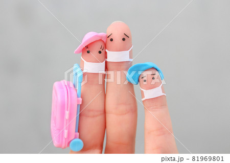 Fingers art of happy family with face mask. Man and woman going on vacation. Fingers art of happy family with face mask. Man and woman going on vacation. 81969801