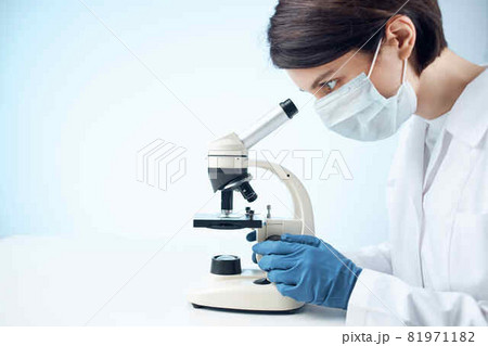 Woman in white coat microscope science work professionals 81971182