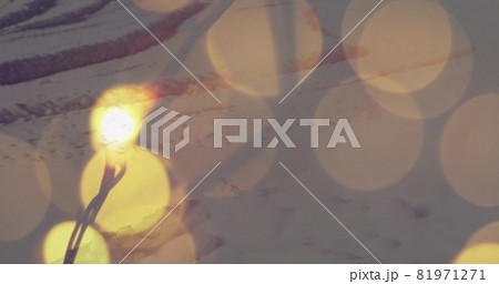 Image of yellow spots of light with winter scenery in background Image of yellow spots of light with winter scenery in background 81971271