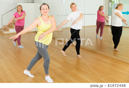Women are dancing in a fitness room 81972498