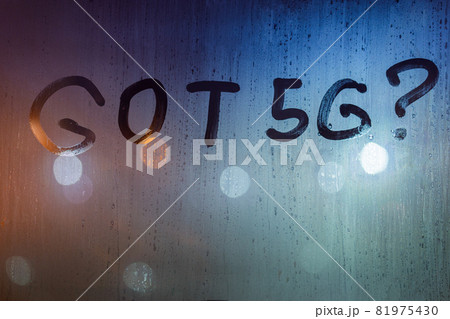 the question got 5G written by finger on wet glass with blurred lights in background the question got 5G written by finger on wet glass with blurred lights in background 81975430