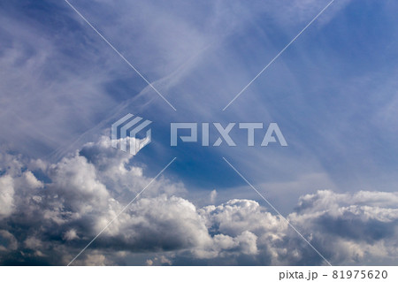 mixed cumulus and feather clouds closeup telephoto shot with polarizing effect. mixed cumulus and feather clouds closeup telephoto shot with polarizing effect. 81975620