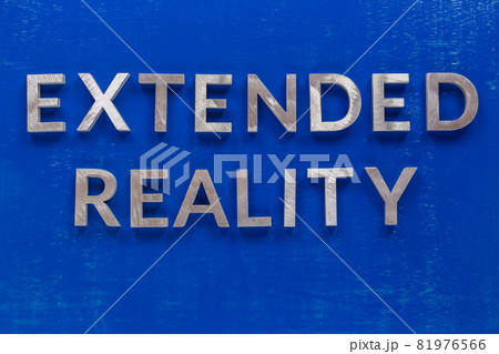 The words extended reality laid on blue painted board with thick silver metal aphabet characters. The words extended reality laid on blue painted board with thick silver metal aphabet characters. 81976566