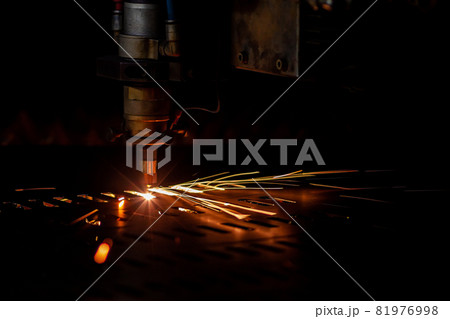 laser cutting process dark closeup with selective focus and sparks laser cutting process dark closeup with selective focus and sparks 81976998