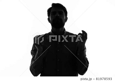 Man Secret agent with a gun in the hands of a crime posing studio Man Secret agent with a gun in the hands of a crime posing studio 81978593