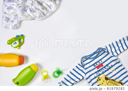 Baby care accessories and clothing on white background, top view Baby care accessories and clothing on white background, top view 81979282