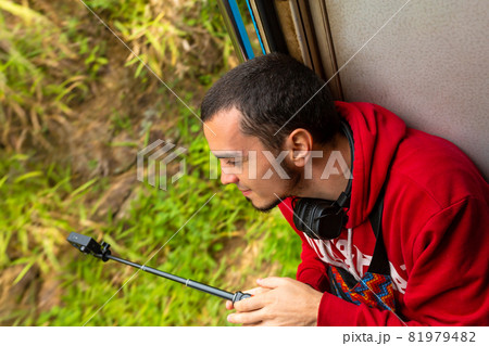 Travel by train in Sri Lanka. A very slow train with no doors. Picturesque places of the island Travel by train in Sri Lanka. A very slow train with no doors. Picturesque places of the island 81979482