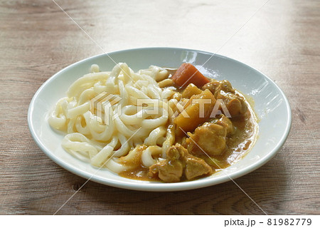 Udon or Japanese rice noodles dressing pork and potato Japanese curry on plate Udon or Japanese rice noodles dressing pork and potato Japanese curry on plate 81982779