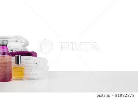 White towels and spa skincare cosmetics on white background White towels and spa skincare cosmetics on white background 81982878