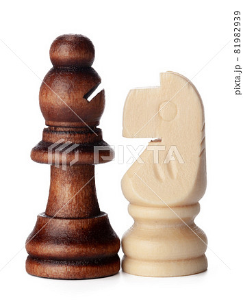 White and brown wooden chess pieces on white background White and brown wooden chess pieces on white background 81982939