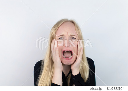 The woman is experiencing a panic attack. The concept of phobia, fears, paranoia and persecution mania. Shadow silhouettes surrounded the man. Nervous breakdown and nervous disorders 81983504