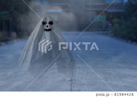 White ghost haunting with a night scene background White ghost haunting with a night scene background 81984428