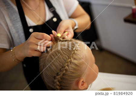 portrait of a young asian woman on the background of meadow and lake 81984920