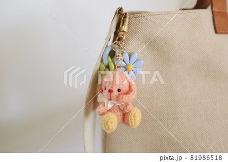 Close-up of handmade keychain in shape rabbit Close-up of handmade keychain in shape rabbit 81986518