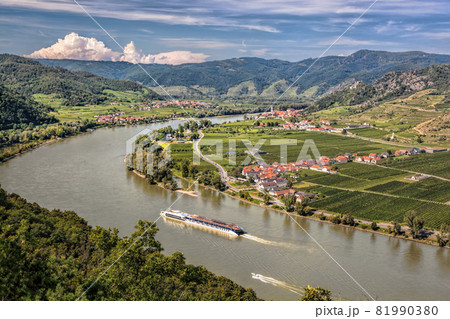 Panorama of Wachau valley (Unesco world heritage site) with ship on Danube river against Duernstein village in Lower Austria, Austria 81990380