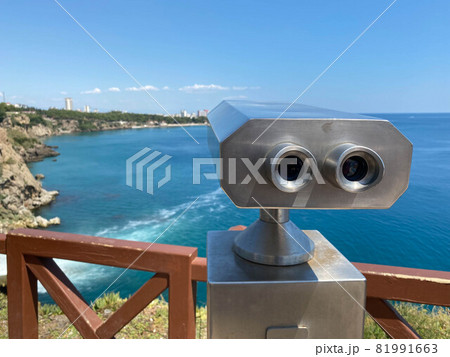 Journey white binoculars telescope on observation deck for tourist viewing sea attractions Journey white binoculars telescope on observation deck for tourist viewing sea attractions 81991663