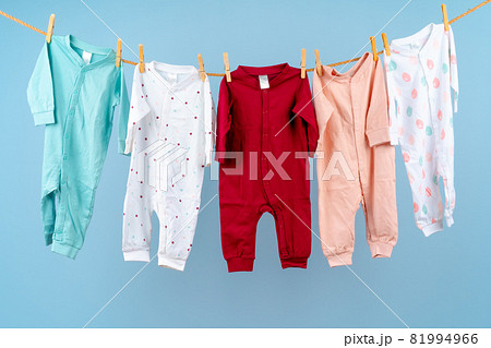 Cute toddler colorful clothing hang on a rope 81994966