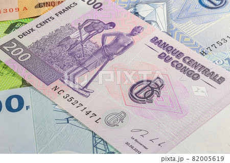 Close up to five thousand Francs of the Republic of Congo. Paper banknotes of the African country. Detailed capture of the front art design. Detailed money background wallpaper. Currency bank note Close up to five thousand Francs of the Republic of Congo. Paper banknotes of the African country. Detailed capture of the front art design. Detailed money background wallpaper. Currency bank note 82005619