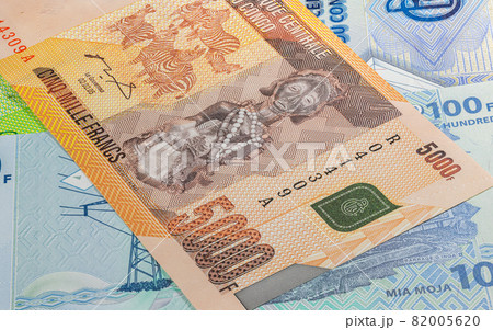 Close up to five thousand Francs of the Republic of Congo. Paper banknotes of the African country. Detailed capture of the front art design. Detailed money background wallpaper. Currency bank note Close up to five thousand Francs of the Republic of Congo. Paper banknotes of the African country. Detailed capture of the front art design. Detailed money background wallpaper. Currency bank note 82005620
