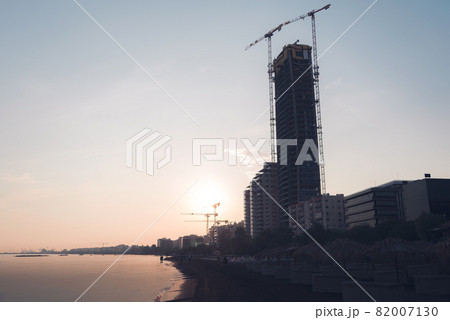 Beach in Limassol with high-rise building construction site 82007130