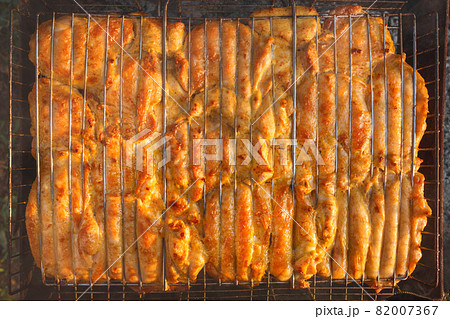 Cooking barbecue chicken meat food on the grill, top view Cooking barbecue chicken meat food on the grill, top view 82007367