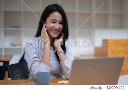 Young undergraduate student studying online class by laptop computer. Young undergraduate student studying online class by laptop computer. 82009102