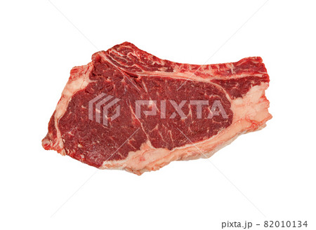 Close up raw beef ribeye steak isolated on white 82010134