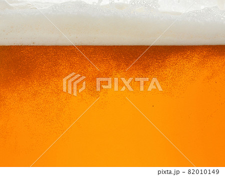 Close up background of beer with bubbles in glass 82010149