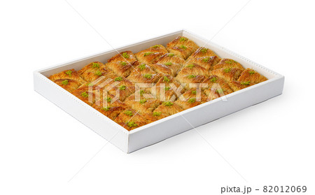 Assortment of Turkish baklava dessert in a white box isolated on white 82012069